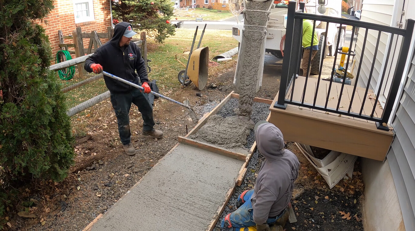 Trusted concrete contractor installing durable walkway for homeowner in Mableton